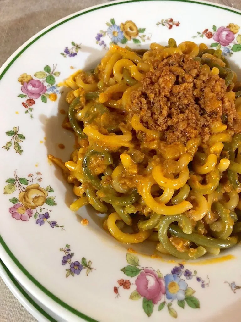 Gramigna alla salsiccia in a flowered bowl