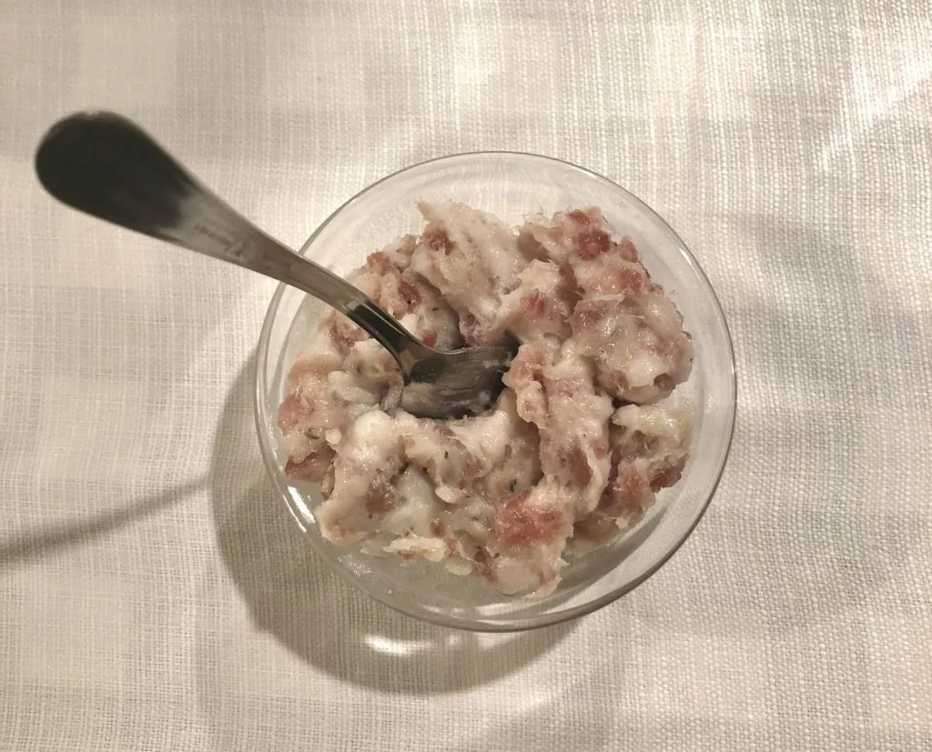 Pesto Modenese in a clear dish with a spoon