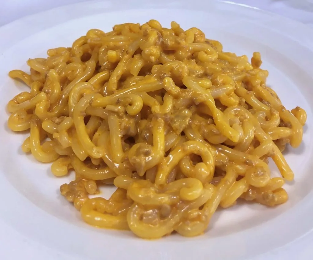 Plate of gramigna alla salsiccia