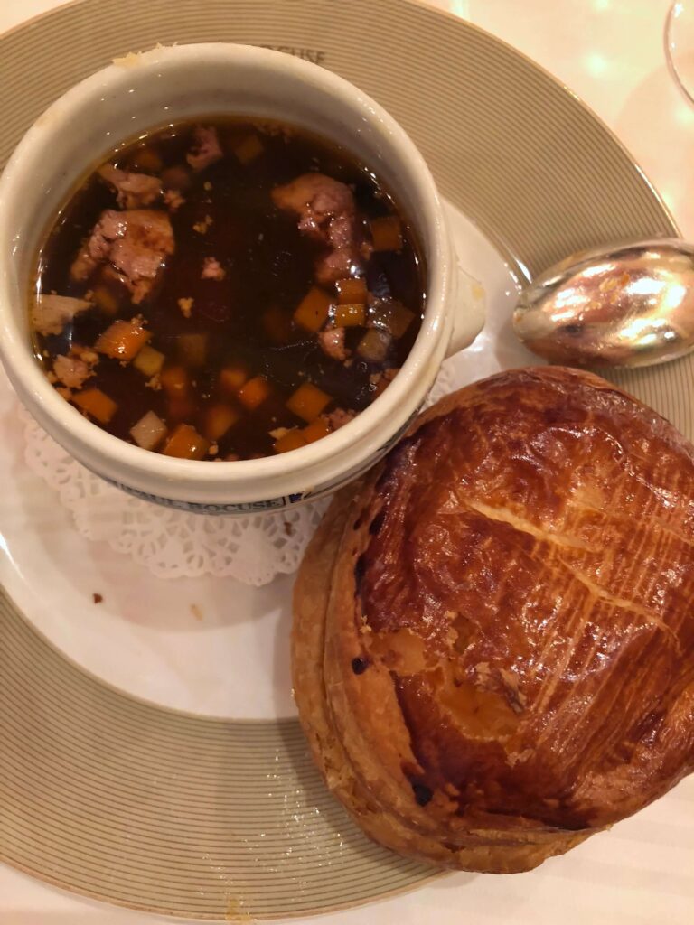 Truffle Soup VGE with puff pastry removed to the side at Paul Bocuse