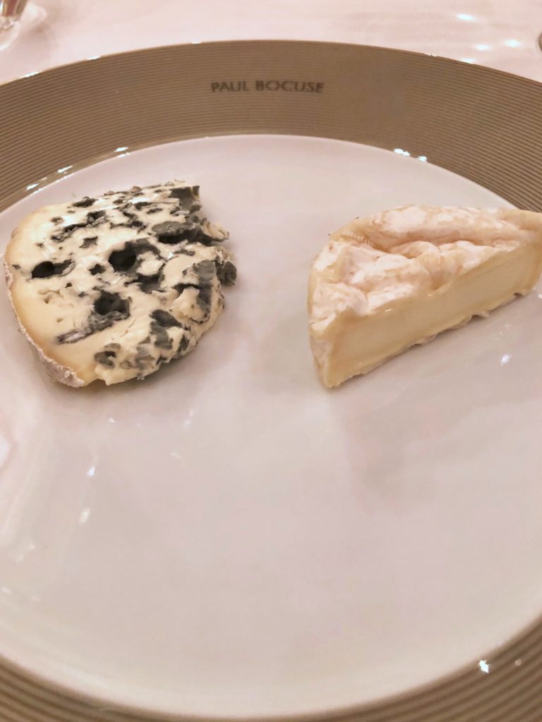 Blue cheese and St. Marcellin cheese on a Paul Bocuse plate
