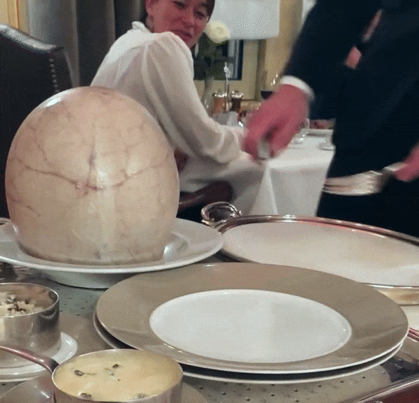 Gif of bladder being popped and pulling the chicken out onto a plate
