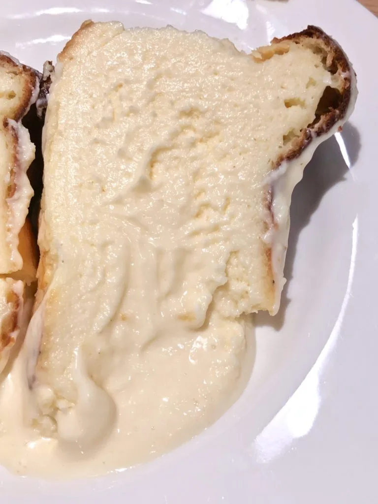 Slice of Basque style cheesecake on a white plate