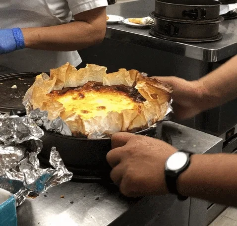 Gif of cheesecake being taken out of spring pan