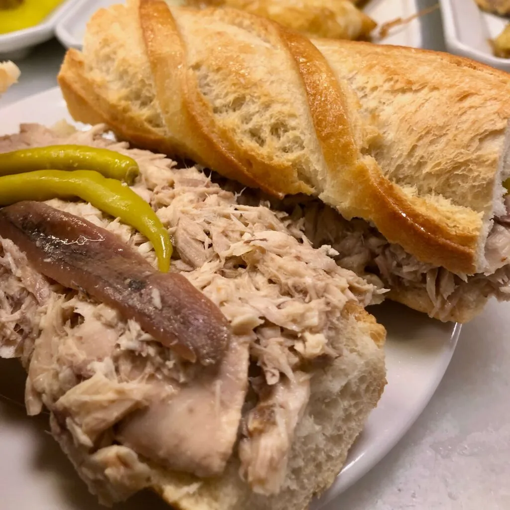 Completo sandwich from Bodega Donostiarra. Spanish white tuna in oil with Cantabrian anchovies and chili peppers on a baguette.