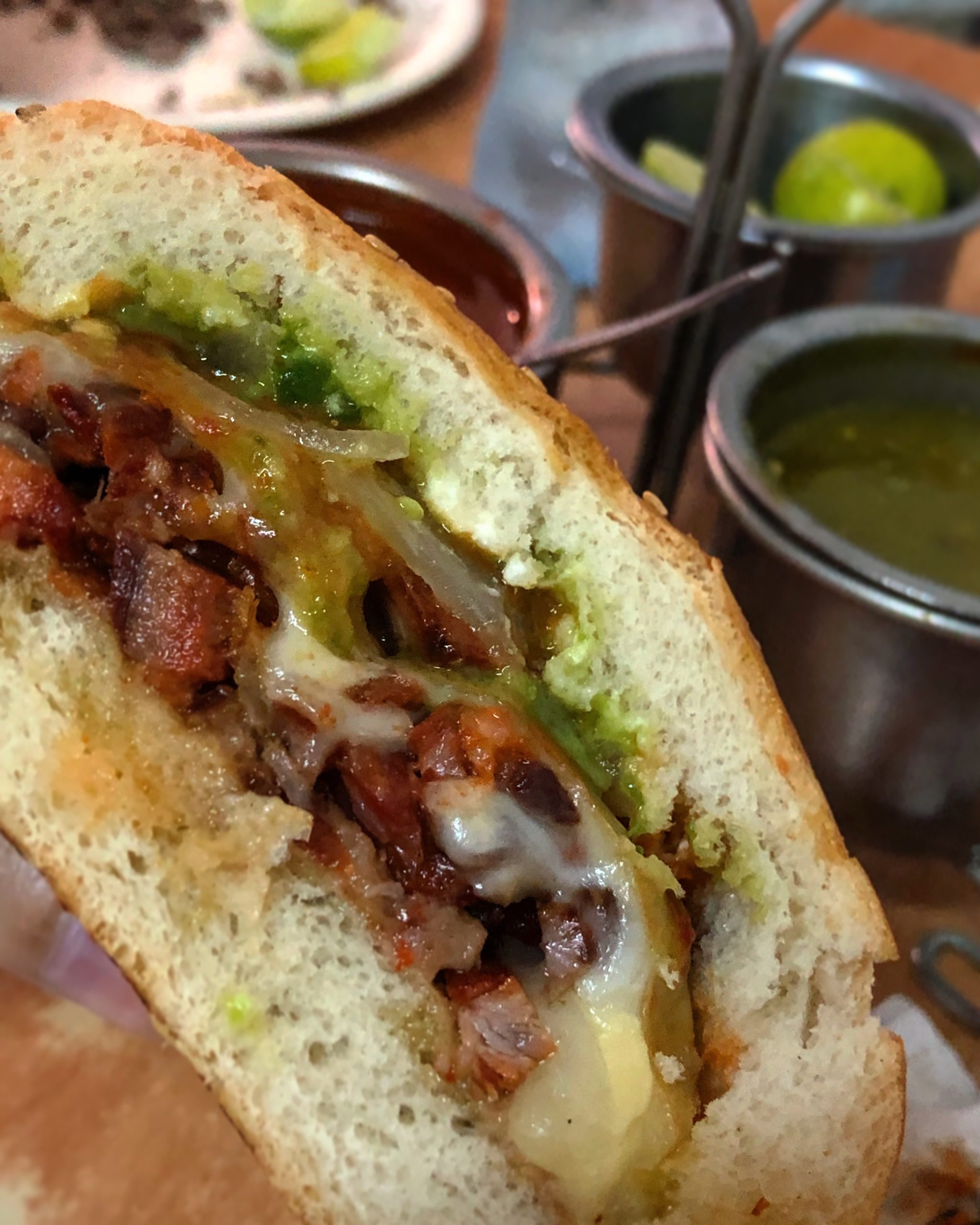 Torta of al pastor with cheese and guacamole