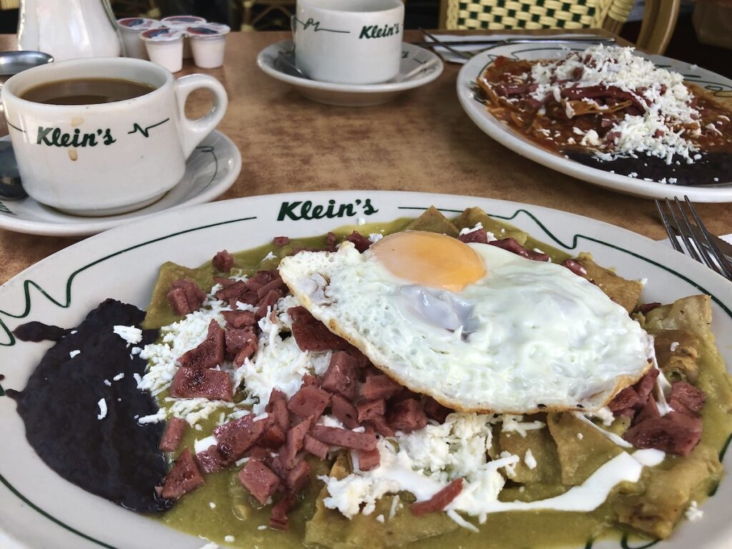 Chilaquiles verdes with salami and a fried egg from Klein's in Mexico City