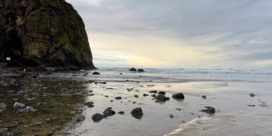 Sunset in front of Haystack Rock in Cannon Beach on the Oregon Coast.