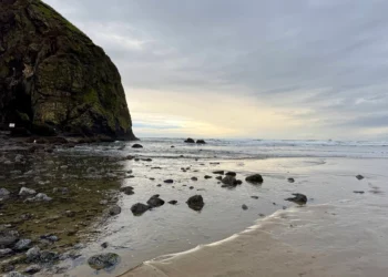Sunset in front of Haystack Rock in Cannon Beach on the Oregon Coast.