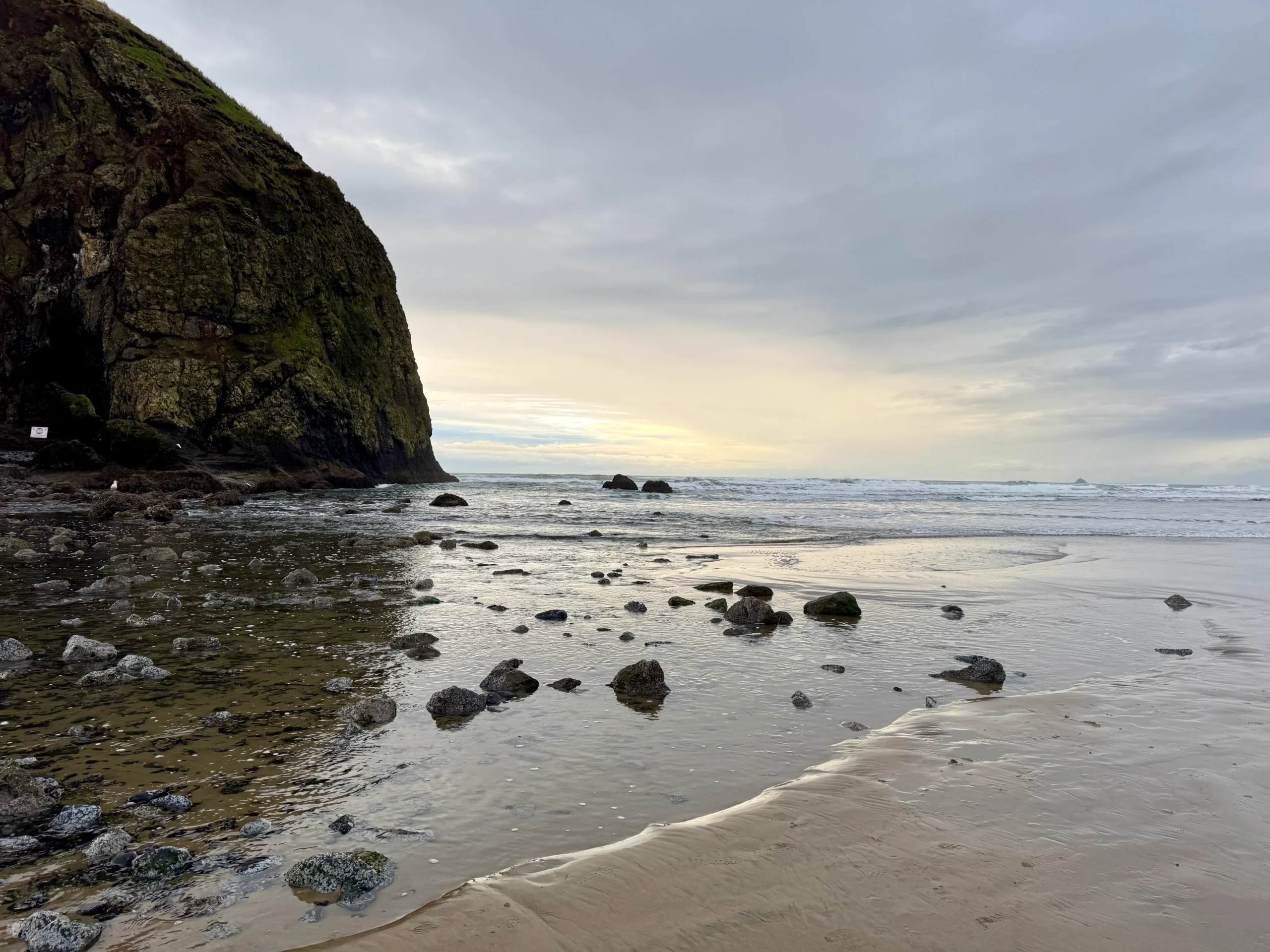 Sunset in front of Haystack Rock in Cannon Beach on the Oregon Coast.